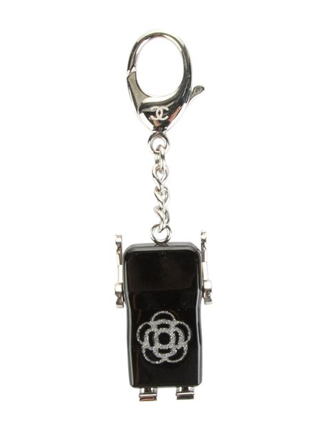 chanel camellia key holder price|Chanel Keychains .